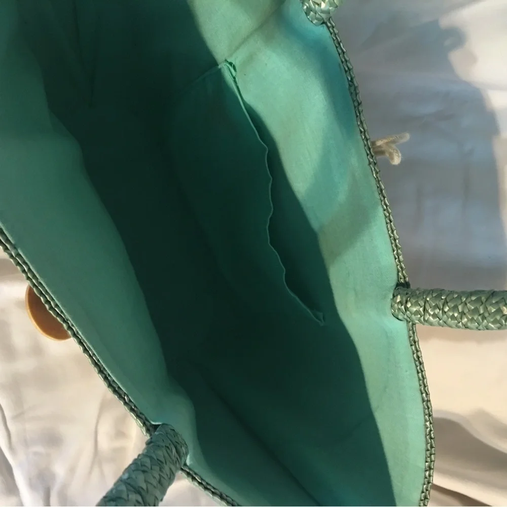 Natural straw bag in green blue, red colors